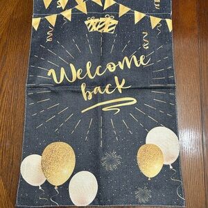 Gold Script 'Welcome Back' Party Banner on Black